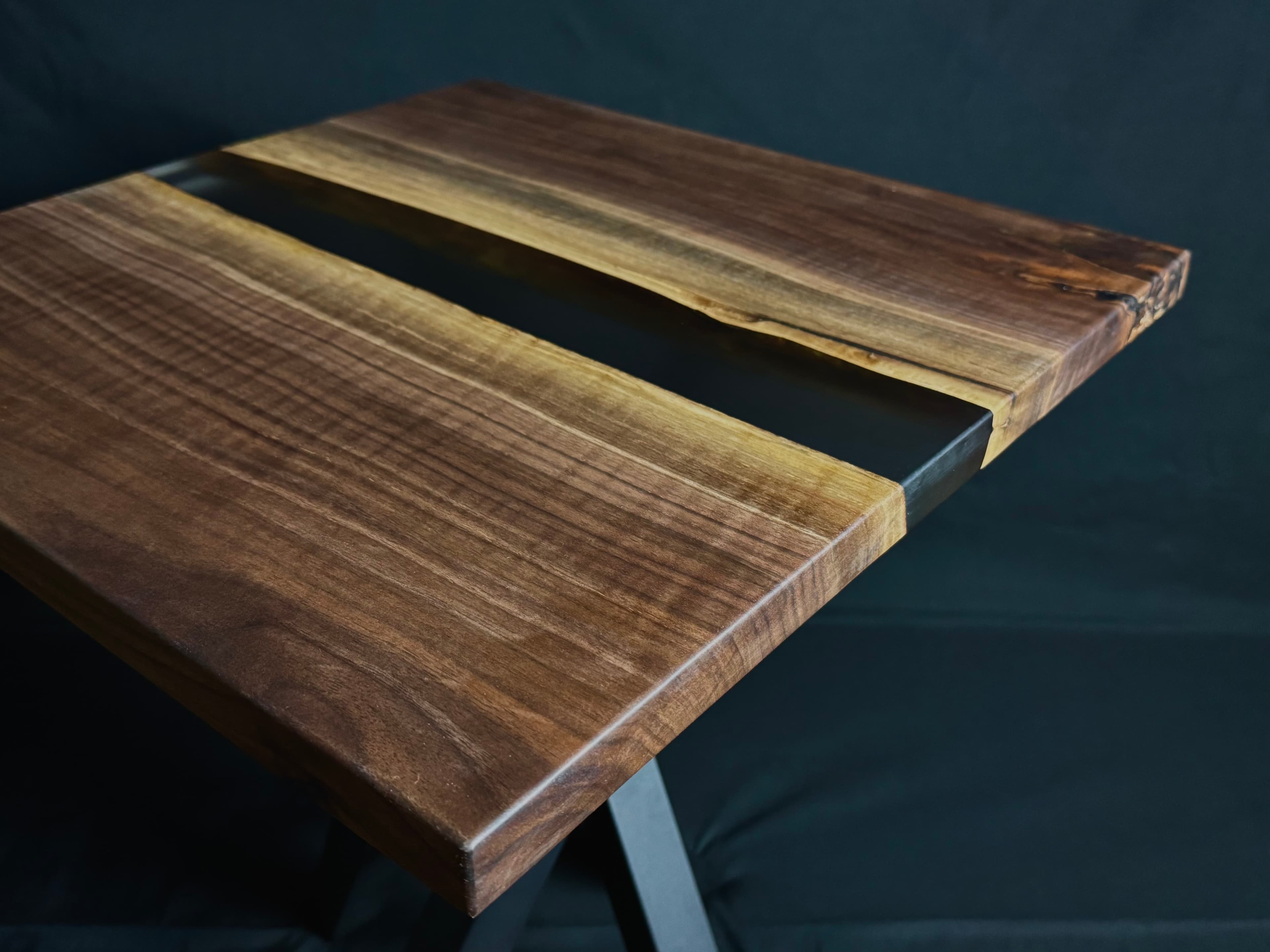 Translucent amber epoxy resin pour highlighting natural walnut grain